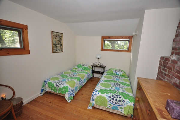 Back bedroom (has doors to main bedroom and outside)